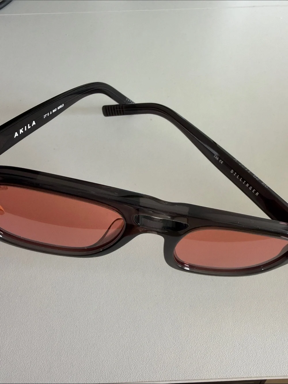 Akila Dillinger Women's Black Frame Sunglasses with Red Lenses